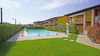 Two-room apartment with spacious balcony in residence with swimming pool in Puegnago del Garda