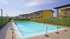 Two-room apartment with spacious balcony in residence with swimming pool in Puegnago del Garda