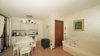 End-of-terrace two-bedroom apartment with large garden and garage in Manerba del Garda 