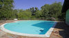 Two-bedroom apartment with dual private outdoor spaces and pool in Manerba del Garda