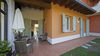 Two-bedroom apartment with dual private outdoor spaces and pool in Manerba del Garda