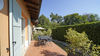 Two-bedroom apartment with dual private outdoor spaces and pool in Manerba del Garda