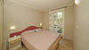 Two-bedroom apartment with dual private outdoor spaces and pool in Manerba del Garda