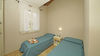 Two-bedroom apartment with dual private outdoor spaces and pool in Manerba del Garda