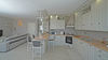 Villa a schiera di testa con giardino privato e garage doppio, in residence con piscina