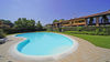 Bright three-room apartment with exclusive living terrace and garage, in residence with pool, in Portese for Sale