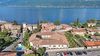 Three-Room Apartment with Private Courtyard, Swimming Pool and Sauna Just Steps from the Lake in Bogliaco di Gargnano.