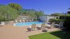 Three-Room Apartment with Private Courtyard, Swimming Pool and Sauna Just Steps from the Lake in Bogliaco di Gargnano.