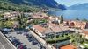 Three-Room Apartment with Private Courtyard, Swimming Pool and Sauna Just Steps from the Lake in Bogliaco di Gargnano.